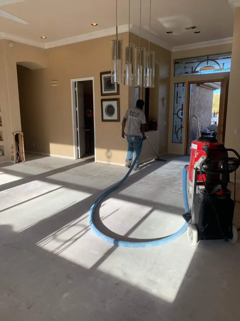Dust Fighters AZ crew performing dustless tile removal in a Phoenix home, keeping the renovation site clean and dust-free