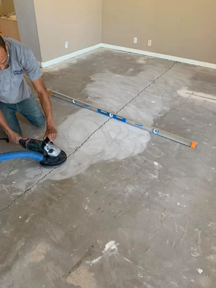 HEPA-filtered grinding equipment preparing concrete floor for epoxy coating in Phoenix